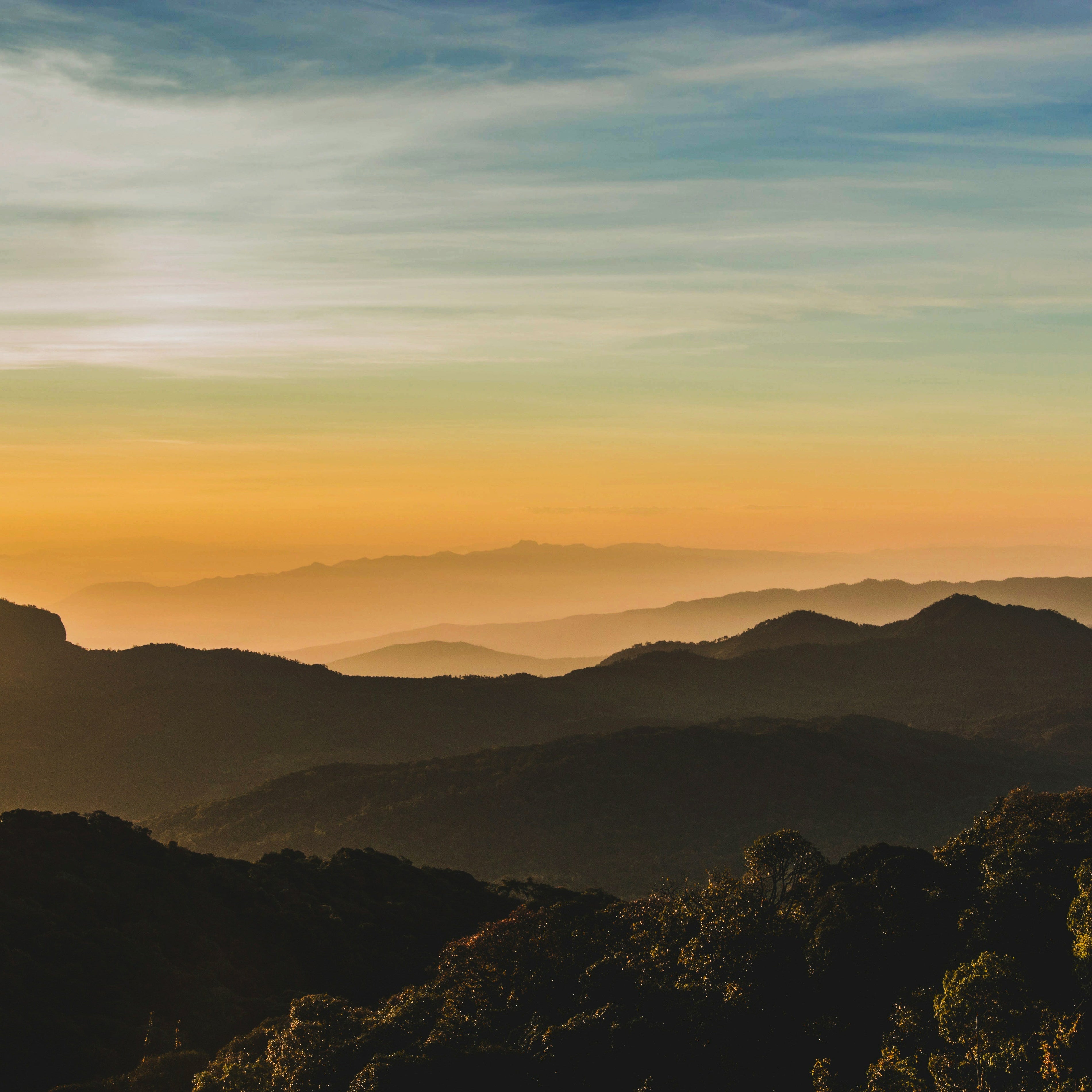 calming mountain view at dawn as sun rises